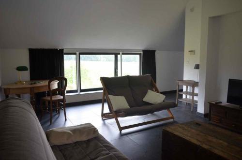 Istumisnurk majutusasutuses Gîte Fenêtres sur cour - Genappe
