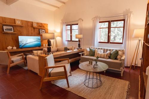 TV a/nebo společenská místnost v ubytování Madaro House