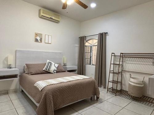 a bedroom with a bed and a window at Large house near Plaza Forjadores-Pet friendly in La Paz