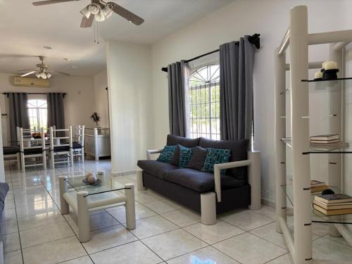 a living room with a couch and a table at Large house near Plaza Forjadores-Pet friendly in La Paz