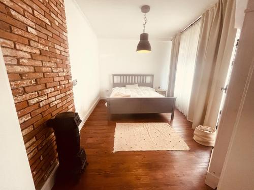 Ένα ή περισσότερα κρεβάτια σε δωμάτιο στο Weener - City Apartment mit Garten