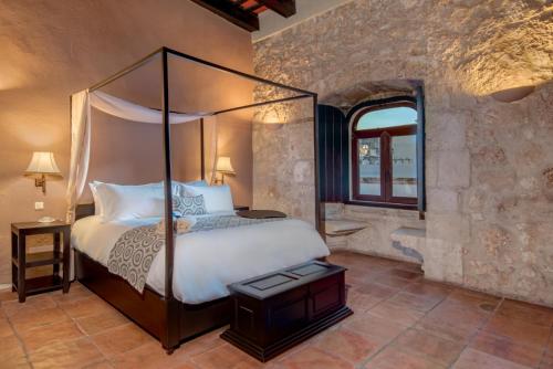 Ένα ή περισσότερα κρεβάτια σε δωμάτιο στο Hodelpa Nicolás de Ovando