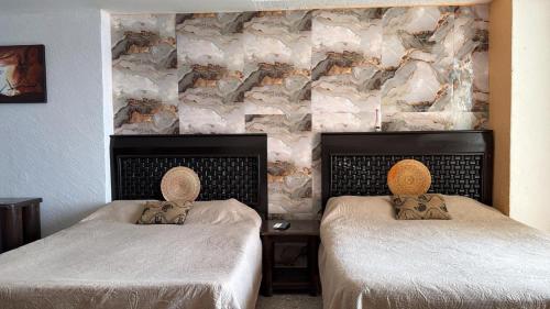 Voodi või voodid majutusasutuse Suite en torres gemelas con vista al mar toas