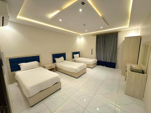 Postel nebo postele na pokoji v ubytování نوفل للشقق المخدومة