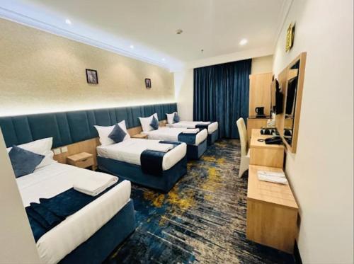 Postel nebo postele na pokoji v ubytování فندق برج دانة