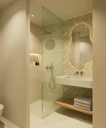 a bathroom with a shower with a sink and a mirror at Ipanema Park in El Arenal