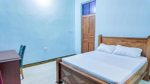 Ένα ή περισσότερα κρεβάτια σε δωμάτιο στο Faida general enterprises