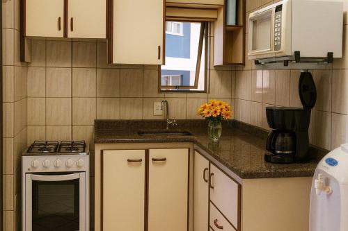 Køkken eller tekøkken på Apartamento Pruner Meia Praia