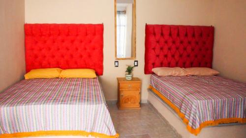 Postel nebo postele na pokoji v ubytování Casa de los Abuelos