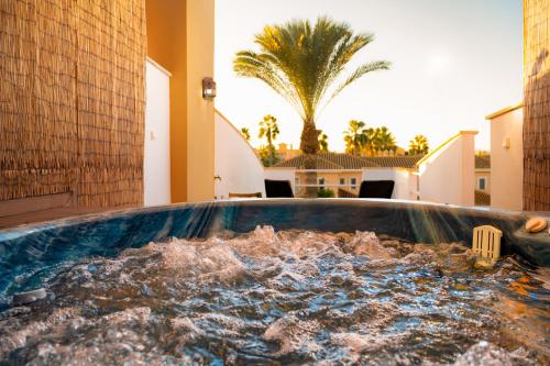 a pool of water in the middle of a house at TrendyHomes Laguna Beach in Vera