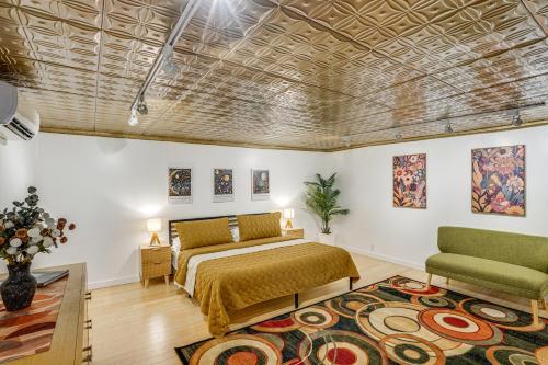 a bedroom with a bed and a rug at Walk to Athens Riverfront Park! Modern-Retro Apt in Athens