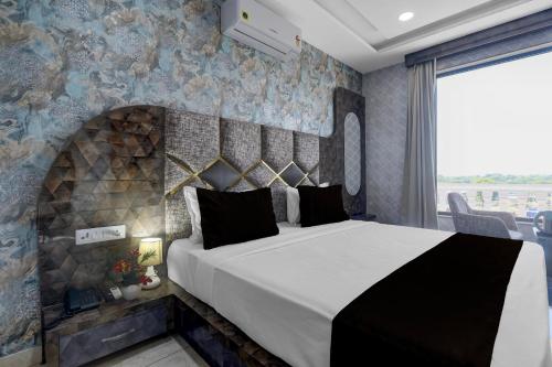 Postel nebo postele na pokoji v ubytování Hotel O RG PALACE HOTEL