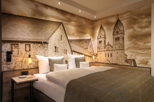 a bedroom with a large bed with a castle mural at Nägler´s Fine Lounge Hotel in Oestrich-Winkel