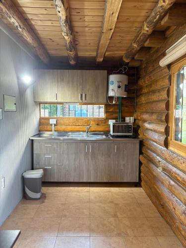 a kitchen with a sink and a counter top at Altandes Cabañas in Vista Flores