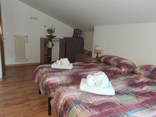 Postel nebo postele na pokoji v ubytování apartment Ravelli