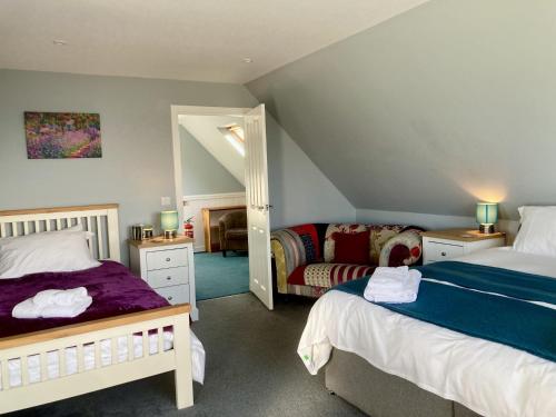 Postel nebo postele na pokoji v ubytování Tarasaigh House