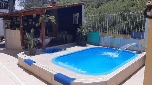 Πισίνα στο ή κοντά στο Casa em Rio das Ostras