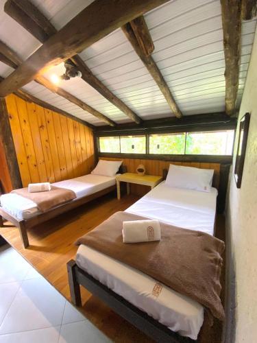 Voodi või voodid majutusasutuse Chalé Maranata- ar, ofurô, wifi e churrasqueira toas