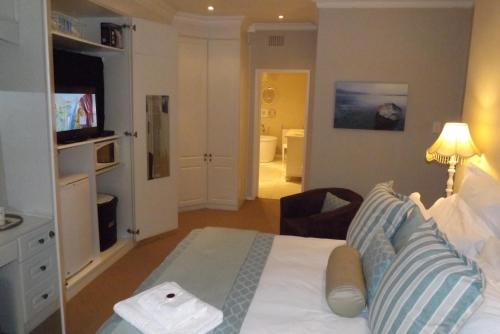 Una televisión o centro de entretenimiento en Tiree B&B