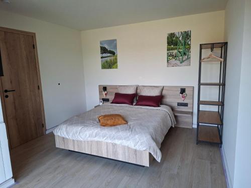 Ένα ή περισσότερα κρεβάτια σε δωμάτιο στο B&B De Scheldeberg