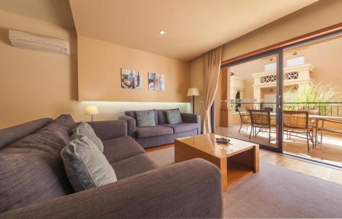 a living room with a couch and a table at B27 - LuzBay 2 Bed Apartment in Luz