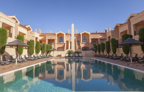 a swimming pool in the courtyard of a villa at B27 - LuzBay 2 Bed Apartment in Luz