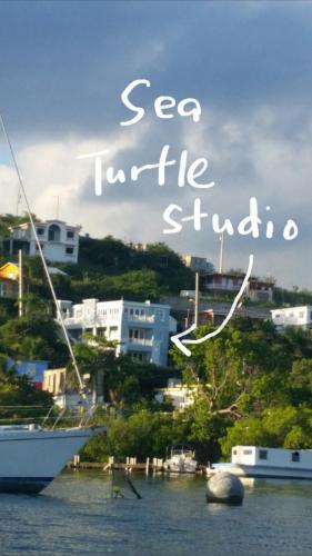 a boat is docked in a body of water at Island Charm Culebra - Studios & Suites - Amazing Water views in Culebra Puerto Rico! in Culebra