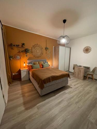 a bedroom with a large bed and a desk at Desert Rose 34 in Mayen in Mayen