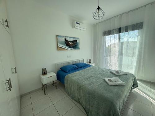 Postel nebo postele na pokoji v ubytování B2 Kiza Pegia Apt