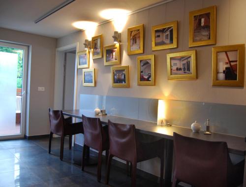 a dining room with a table and chairs at BnB Comfort Guesthouse Olten - Lostorf in Lostorf