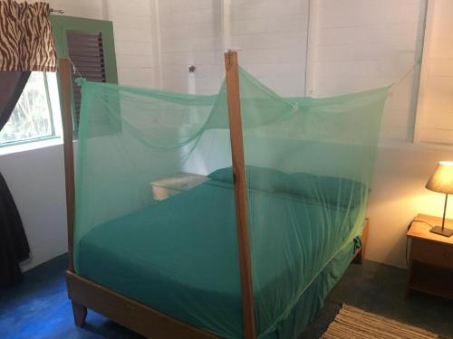 En eller flere senge i et værelse på Casa Ylang Ylang, Playa Encuentro