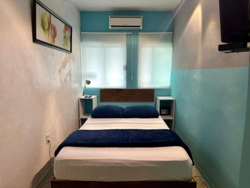 Ένα ή περισσότερα κρεβάτια σε δωμάτιο στο Brisa Marina Suites - Atras de Playa regatas y Malecon