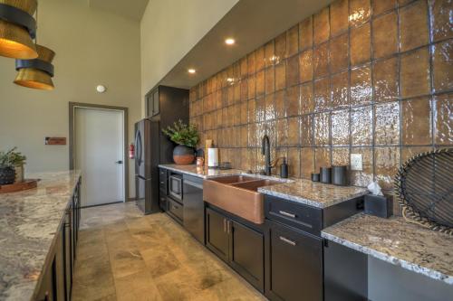 a large kitchen with a sink and a refrigerator at Ski Run View Red Lodge in Red Lodge