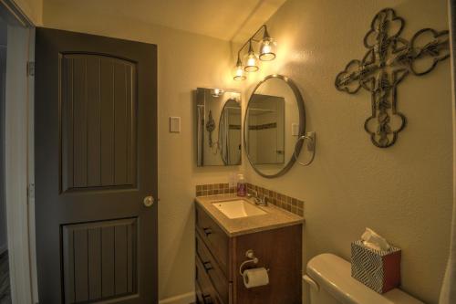 a bathroom with a sink and a toilet and a mirror at Daybreak Haven Red Lodge in Red Lodge