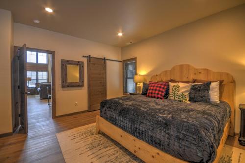 a bedroom with a large bed with a wooden headboard at Beartooth Dream, Red Lodge in Red Lodge