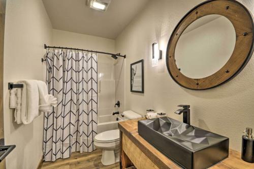a bathroom with a sink and a toilet and a mirror at Hauser House Unit 1 in Red Lodge