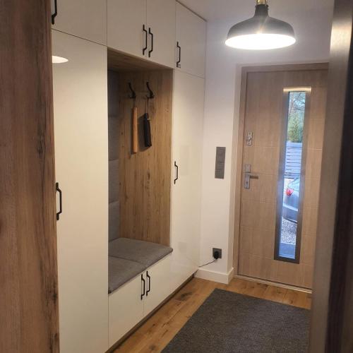 a room with a walk in closet and a door at Wypoczynek KOPANICA in Kopanica