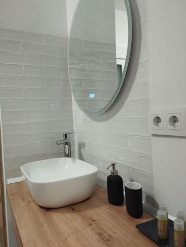 a bathroom with a white sink and a mirror at Casa Rural Las Matillas in Riópar