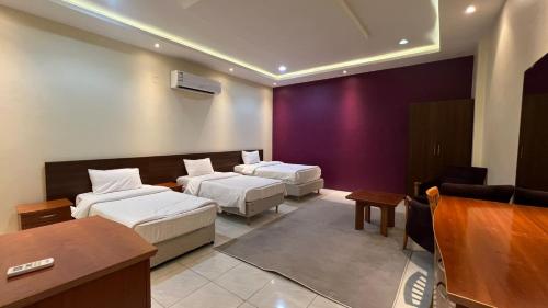 Ένα ή περισσότερα κρεβάτια σε δωμάτιο στο شقق واحة بيروت