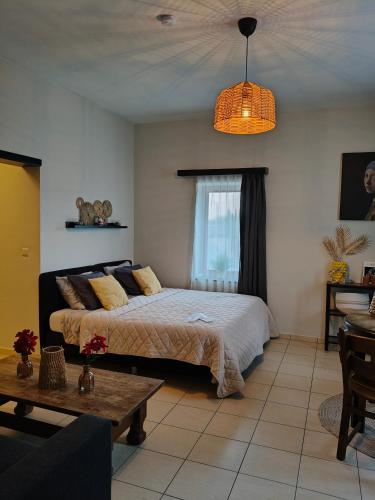 a bedroom with a bed and a table at De Smokkelhoeve in Riemst