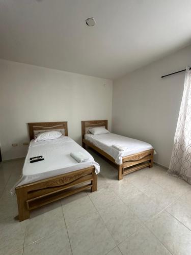 Кровать или кровати в номере Apartamento con cinco habitaciones y parqueadero