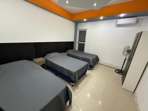 Postel nebo postele na pokoji v ubytování Departamento Rojas 1