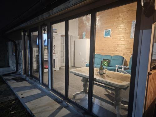 a view of a living room with a table and chairs at Casuta Din Poveste Gold Craiova in Craiova