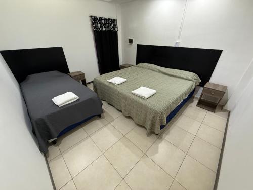 Postel nebo postele na pokoji v ubytování Departamento Rojas 2