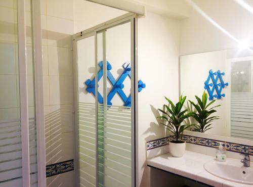 a bathroom with a shower and a sink at Casa-Casita in Marbella