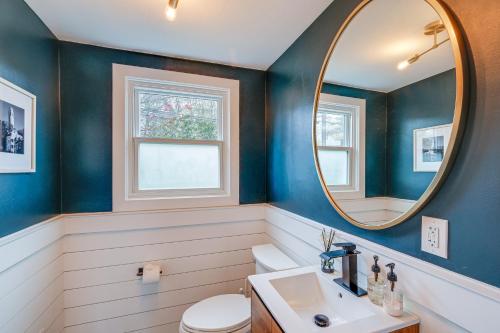 a bathroom with blue walls and a mirror at Upscale Family Retreat Near DC and Georgetown! in North Bethesda
