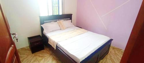 Ένα ή περισσότερα κρεβάτια σε δωμάτιο στο Mike's HOUSE