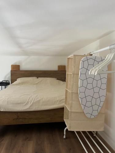 a bedroom with a bed with a wooden frame at City Loft in Belgrade