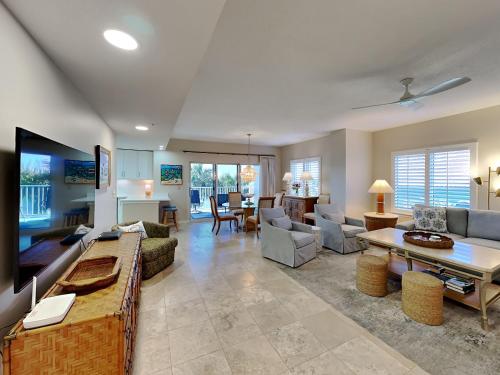 a living room with a couch and a table at South Harbour 2f in Pensacola Beach