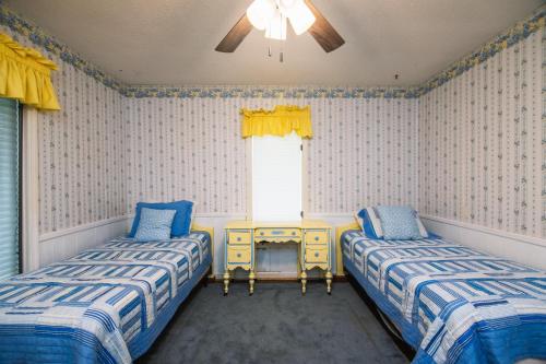 En eller flere senge i et værelse på Amazing Grace